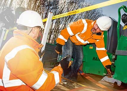 Man Stood On A Flat Bed Truck Training A Person On Rope Quality